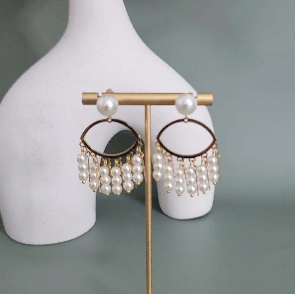 Stainless steel gold tone pearl evil eye earrings